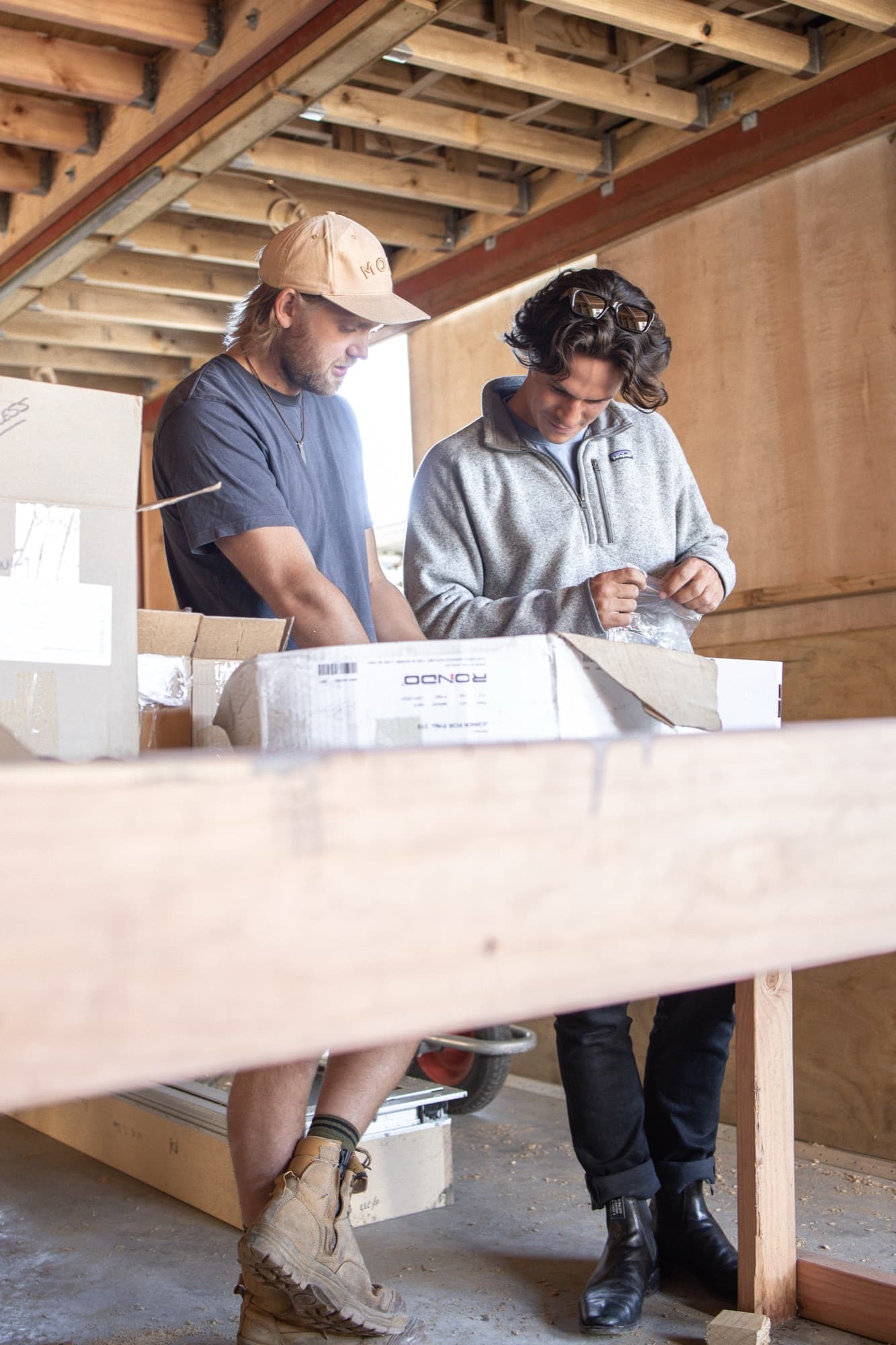 Electrical contractors reviewing plans on site